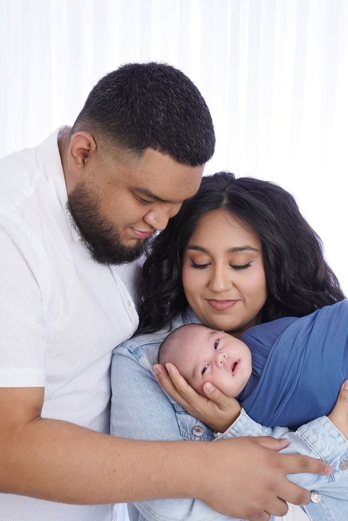 Bryan and his partner with their baby